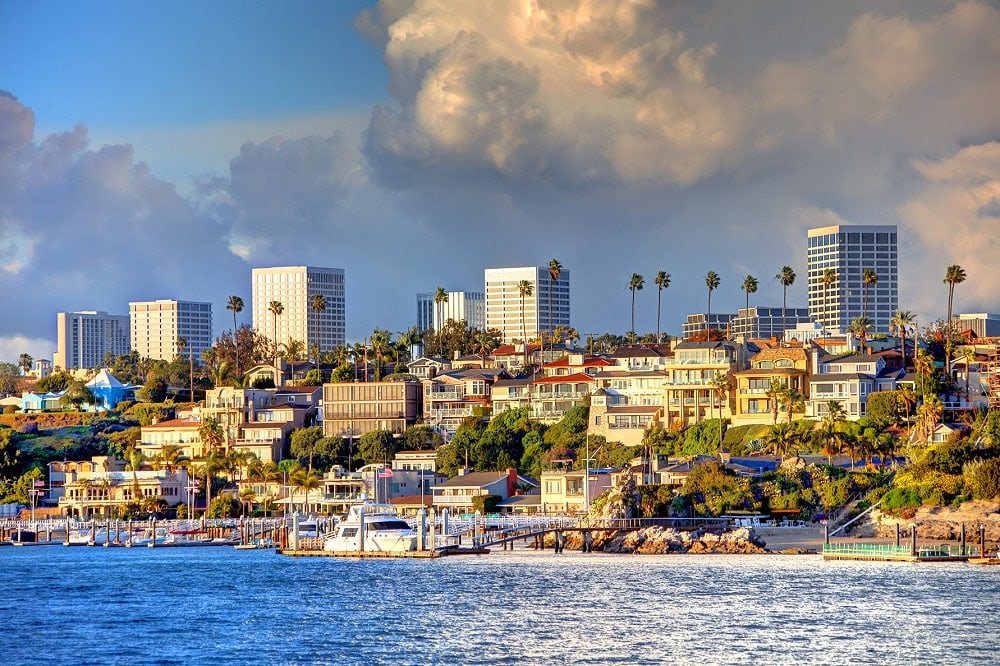 Coastal cityscape with boats and skyline