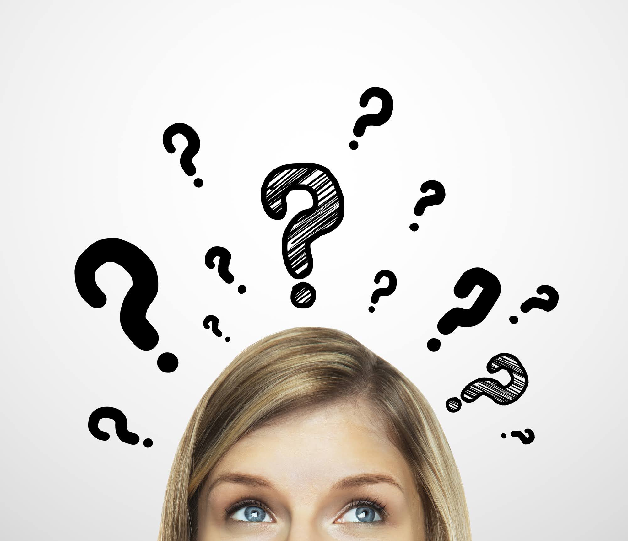 Curious woman surrounded by question marks