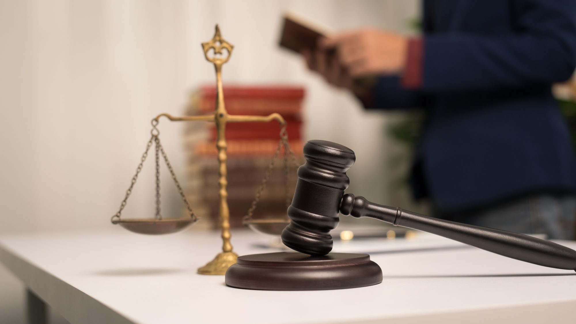 Judge's gavel resting on law books