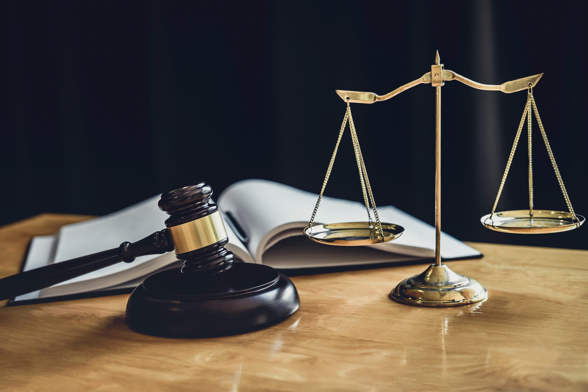 Judge's gavel resting on law books