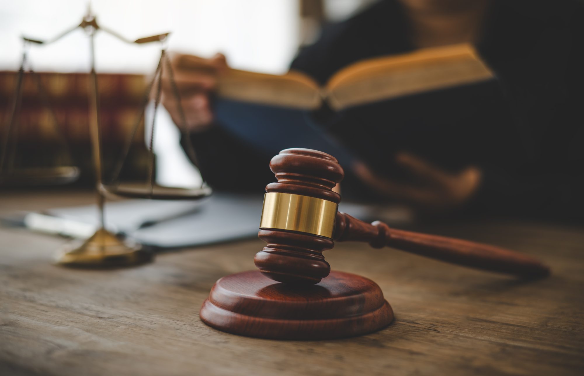 Judge's gavel resting on law books